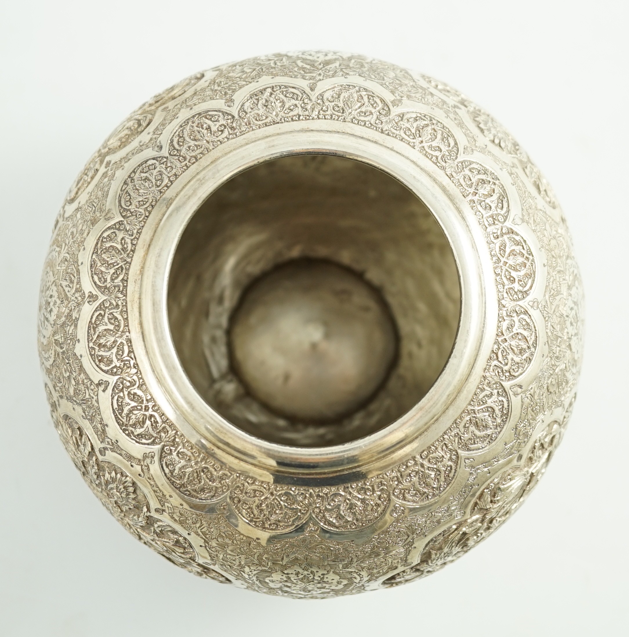 A 20th century Persian 84 standard embossed and engraved white metal vase, height 14cm, 17.4oz.